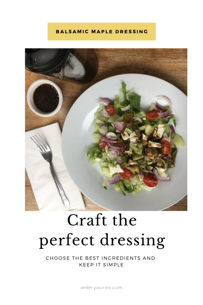 Salad Dressing made with oil, vinegar and maple syrup drizzled over garden salad