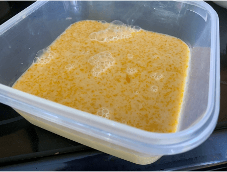 cream and maple syrup mixture poured into plastic container