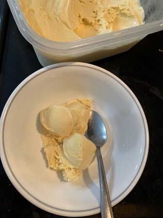 Ice cream served in a bowl with spoon