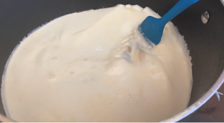 ice cream mixture being stirred in pot