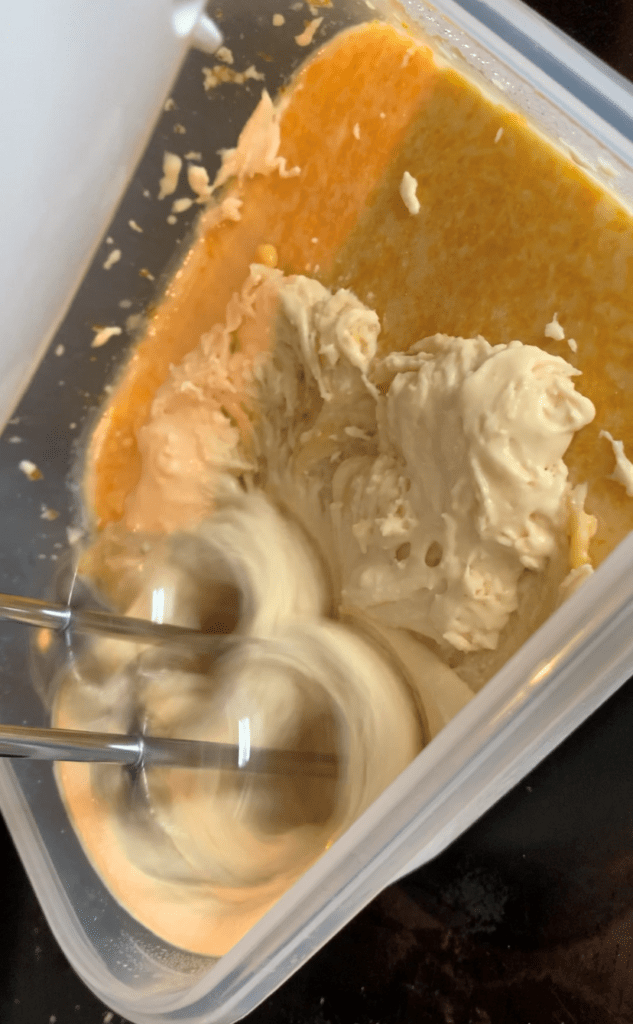 ice cream being whipped with hand mixer